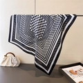 Detailed view of square silk scarf with black polka dots and geometric frame pattern - 70x70cm / Black