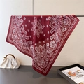 Elegant wine red paisley satin silk square scarf draped on a metal hanger display - One Size / Red