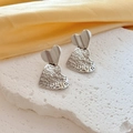 Silver hollow heart-shaped drop earrings with lace-like mesh on stone and silk background - Silver Heart Style (G219)