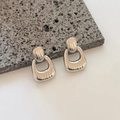 Modern geometric textured silver earrings with minimalist vertical striped pattern - Silver