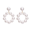 Elegant white pearl hoop earrings featuring a creative circular beaded design and stud - Gold