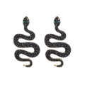 Golden snake earrings with black beads and green gem eyes on a clean white background - Black