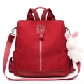 Red corduroy backpack for women featuring a plush bunny charm and stylish metal zipper - Red