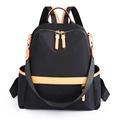 Zaino da donna impermeabile in nylon nero con finiture in pelle gialla e zip dorate - Nero