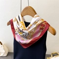 Elegant silk-like square scarf featuring gold chain and leopard print draped on a black top - Wine Red