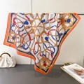 Detailed close-up of retro chain print on silk-like square scarf with elegant draping - Vintage Chain Orange Style (FG264-3)