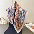 Classic chain print silk square scarf with gold rope and gemstone patterns hanging on a hanger - Vintage Chain White Style (FG264-4)