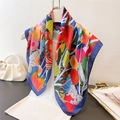 Bohemian floral printed silk square scarf styled with elegant white pearl handbag - Navy Blue