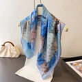 Detailed close-up of blue and white floral silk scarf draped on a white hanger - 66-70cm / Blue (FG286-2)