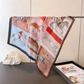 Detailed view of silk-like scarf featuring equestrian horse prints and dark brown borders - 70cm / Brown