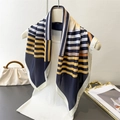 Close-up of geometric striped silk scarf on mannequin showing fabric texture and edge detail - 66-70cm / Black
