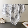 Detailed view of paisley silk-feel scarf draped with a vintage floral pattern and border - 70cmx70cm / White