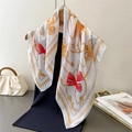 Silk-like satin scarf with golden chain and red bow print draped on a model - 66-70CM / White