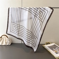 Elegant white square silk scarf with brown geometric lines draped on a metal hanger - Brown / 70cmx70cm