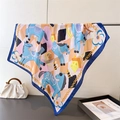 Blue horse print silk scarf draped over a metal rod with a stylish white handbag - Blue