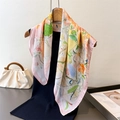 Elegant oil painting floral silk scarf with vibrant pink and yellow blossoms on a hanger - Light Pink