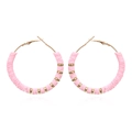 Detail of pink Heishi clay beads and gold metal spacers on large bohemian hoop earrings - Pink