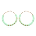 Macro detail of Bohemian large hoop earrings with mint green heishi beads and gold spacers - Light Green