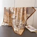 Detail of premium houndstooth and rose print silk scarf on a metallic display stand - Deep Brown (FN277-1)