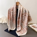 Elegant houndstooth and rose print silk scarf hanging gracefully on a wooden hanger - Pink (FN277-4)