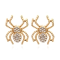 Vintage gold spider stud earrings with sparkling white crystals on a white background - Gold