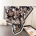 Detailed texture of French rose print silk scarf with classic striped borders - 90x90cm / Black