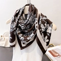 Detailed view of floral faux silk square scarf featuring vintage monochrome prints - Coffee