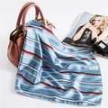Close-up of silk scarf with blue and red stripes draped over a pink handbag - 50cm x 50cm / Sky Blue Red White Striped