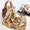 Detail of a silk satin square scarf with equestrian chain pattern draped over a handbag - 50cm x 50cm / Beige Gold Horse Chain