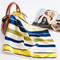 Detail of a striped satin scarf in navy and yellow draped over a pink handbag elegantly - 50cm x 50cm / Navy Yellow White Striped