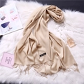 Detail of beige cashmere scarf with elegant tassels on a soft white plush background - Light Khaki (FYR150-21)