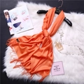 Detail of bright orange cashmere scarf with fine fringes and classic fabric label - Orange-Yellow (FYR150-07)