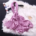 Detail of light purple cashmere scarf with tassels on a white faux fur rug background - Pink-Purple (FYR150-09)