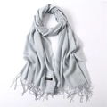 Detailed view of light blue cashmere shawl featuring soft fringed edges and fine texture - Light Gray