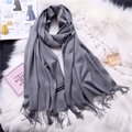 Detailed macro view of soft gray cashmere feel scarf with fringe trim and texture labels - Heather Gray (FYR150-16)
