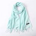 Detail of light mint green cashmere scarf with fringe tassels and material brand label - Light Green