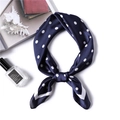 Navy blue polka dot satin scarf tied in a bow with white geometric borders and silk luster - 70x70cm / Navy Blue