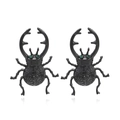 Exaggerated black beetle earrings with green gemstone eyes and detailed texture - Black
