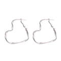 Minimalist silver-tone twisted heart hoop earrings with a shiny metallic mirror finish - Silver