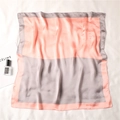 Detail of silk square scarf featuring orange and grey color block with smooth texture - Pink Orange and Gray
