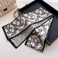 Detailed close-up of paisley pattern silk scarf elegantly folded on a tray display - White Red Black Paisley Style (LJ21-H289) / 145x12cm