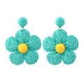 Handmade raffia flower earrings in bohemian style with blue petals and yellow center - Emerald