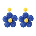 Macro detail of hand-woven raffia flower earrings in navy blue and yellow bohemian style - Dark Blue