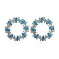 Golden sunburst hoop earrings with alternating blue and light blue baguette crystals - Blue