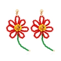 Handmade beaded flower earrings with red petals and yellow centers in boho style - Multi-color