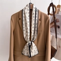 Detail of floral skinny scarf tied on a beige blazer collar for a professional look - Retro Floral White Base Style (LJ21-H256) / 145x12cm