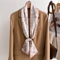 Detail of floral silk scarf tied as a bow on a brown blazer with elegant wood hanger - Beige Light Pink Branch Leaf Style (LJ21-H257) / 145x12cm