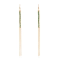 Handcrafted long tassel earrings with green beads and gold chains on a white background - Green