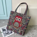 Ethnic canvas tote bag with embroidered red owl and colorful geometric strap - Dark Solo Beauty
