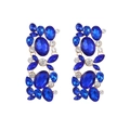 Macro detail of geometric floral earrings with blue rhinestones and gold alloy base - Blue